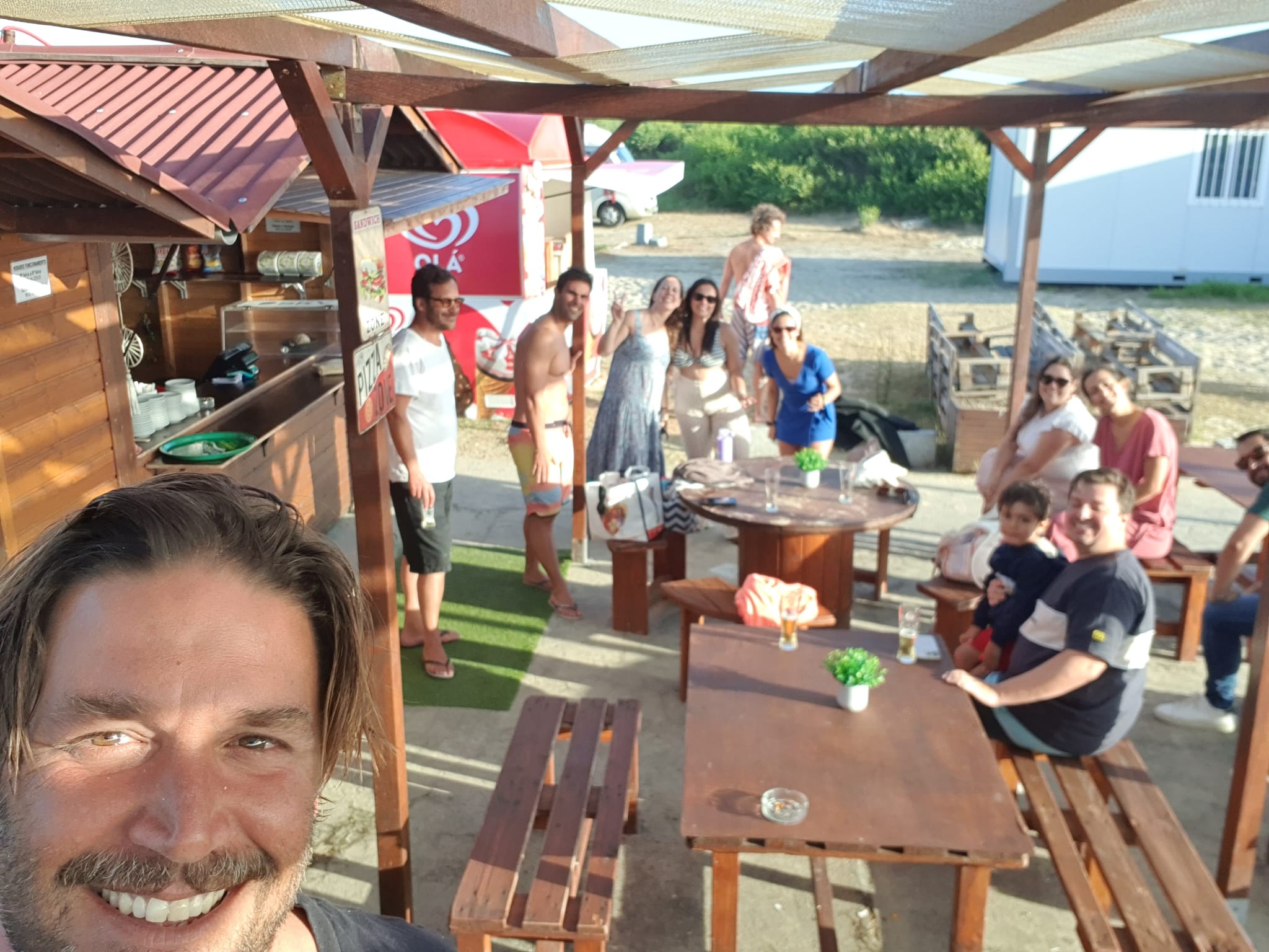 Outdoor gathering after surfing — surf school social Praia da Aguda, Porto Gaia coast